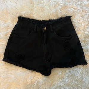 black ripped shorts